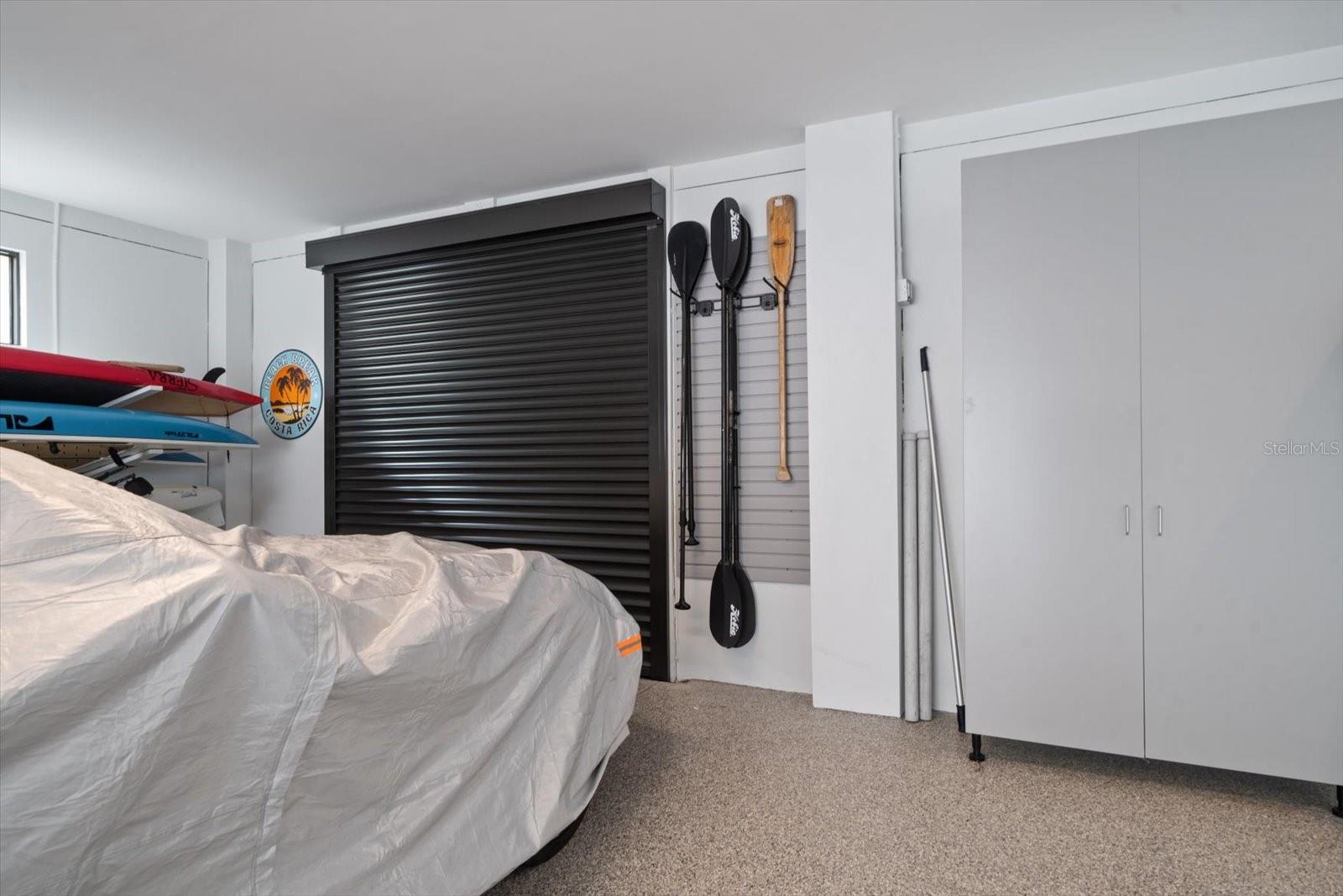 Additional access to garage area for aquatic items on waterside