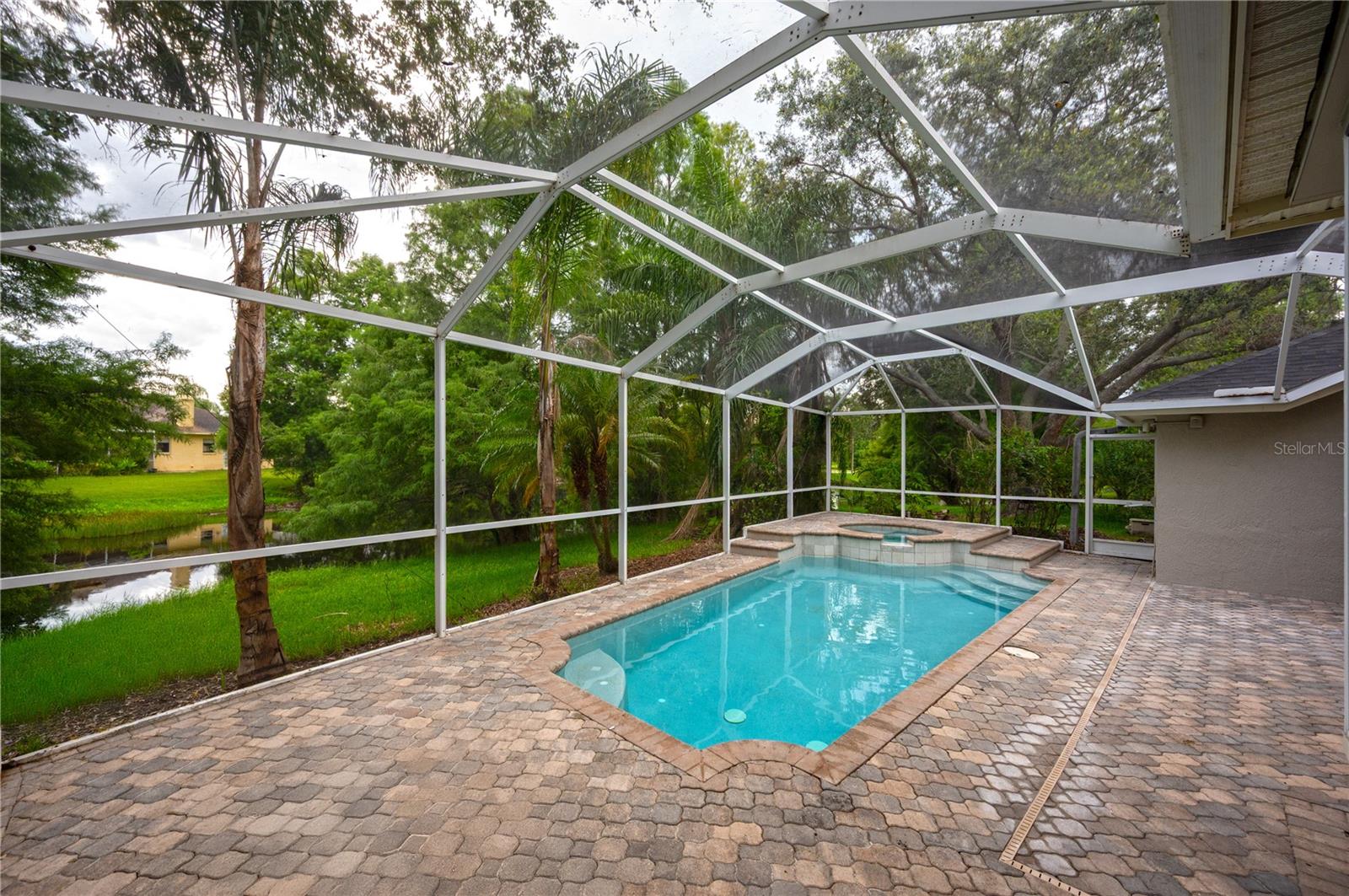 Large pool deck with POND views