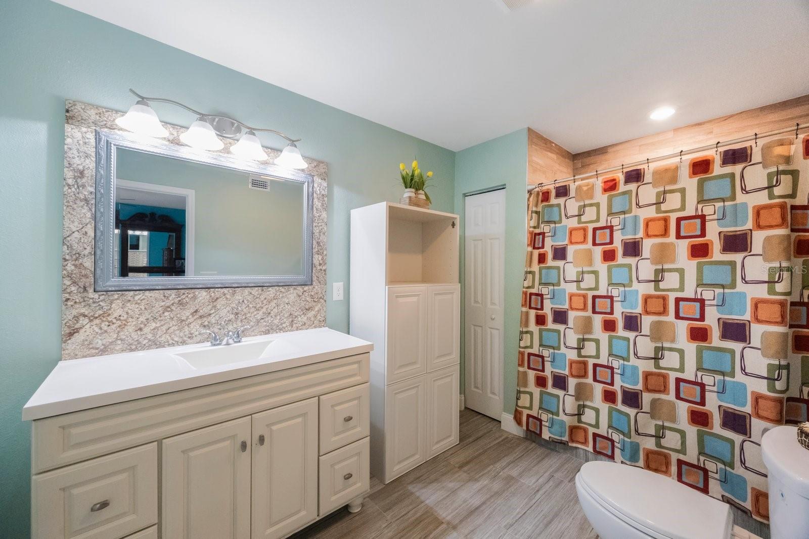Large en suite bathroom with lots of space for toiletries.