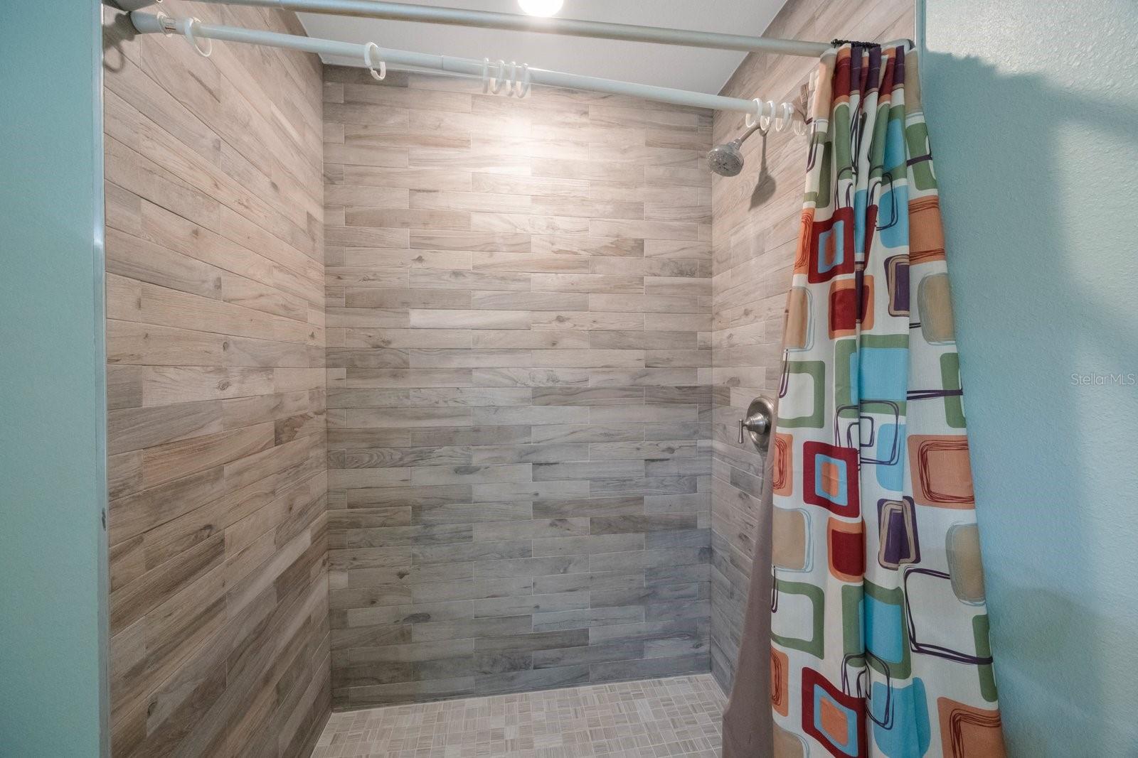 This home has a beautiful tiled walk-in shower, which will be amazing to use after a long day.