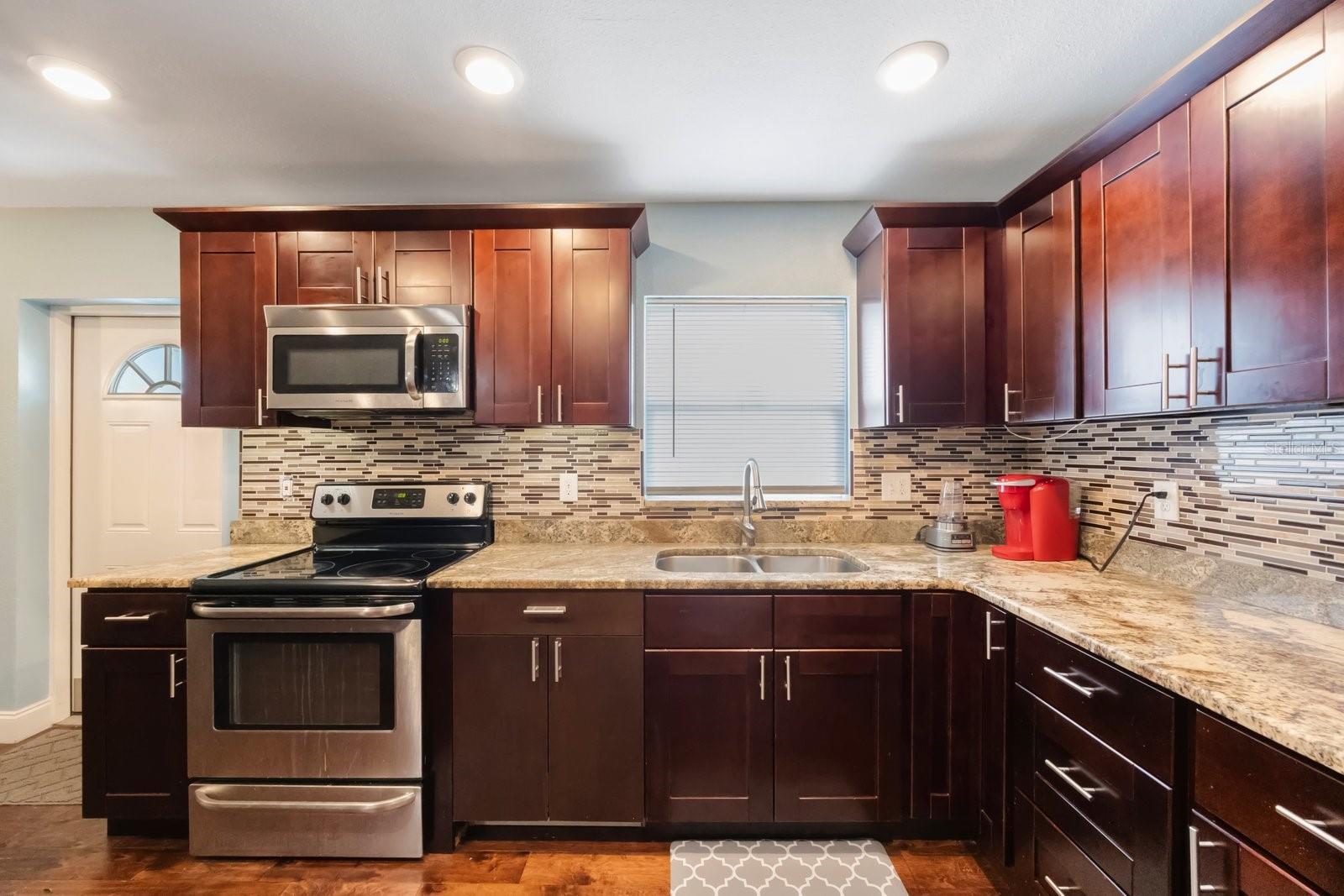 Warm kitchen space with plenty of counter top space.