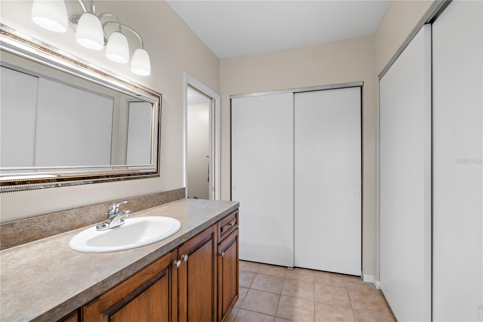 The longer part of the L shape has a 6 ft counter and two closets.
