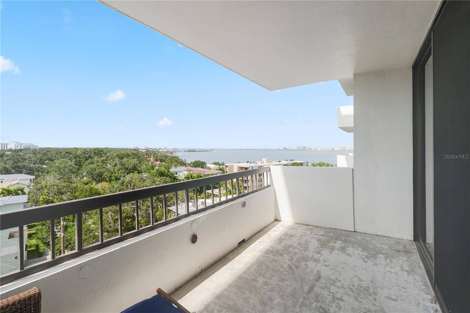 Balcony off the living room with a southwest water view