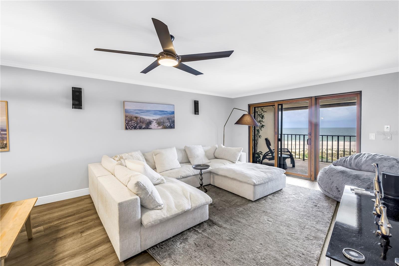 Living area with sliders to the large balcony and beach and Gulf views