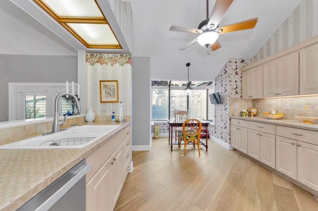 Large bright kitchen with breakfast area and so much storage, including a closet pantry.