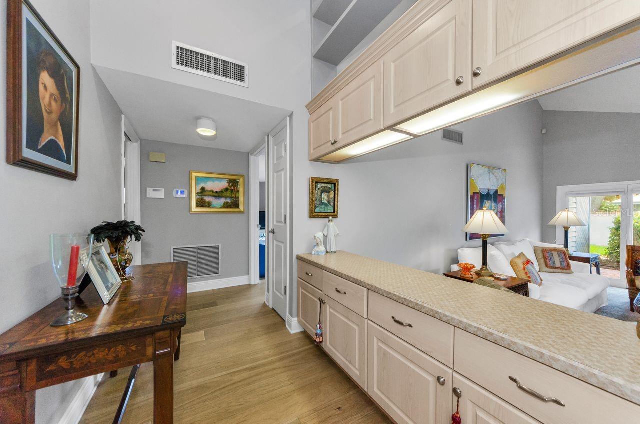 The hallway leading to the bedrooms, laundry and baths overlooks the living room.