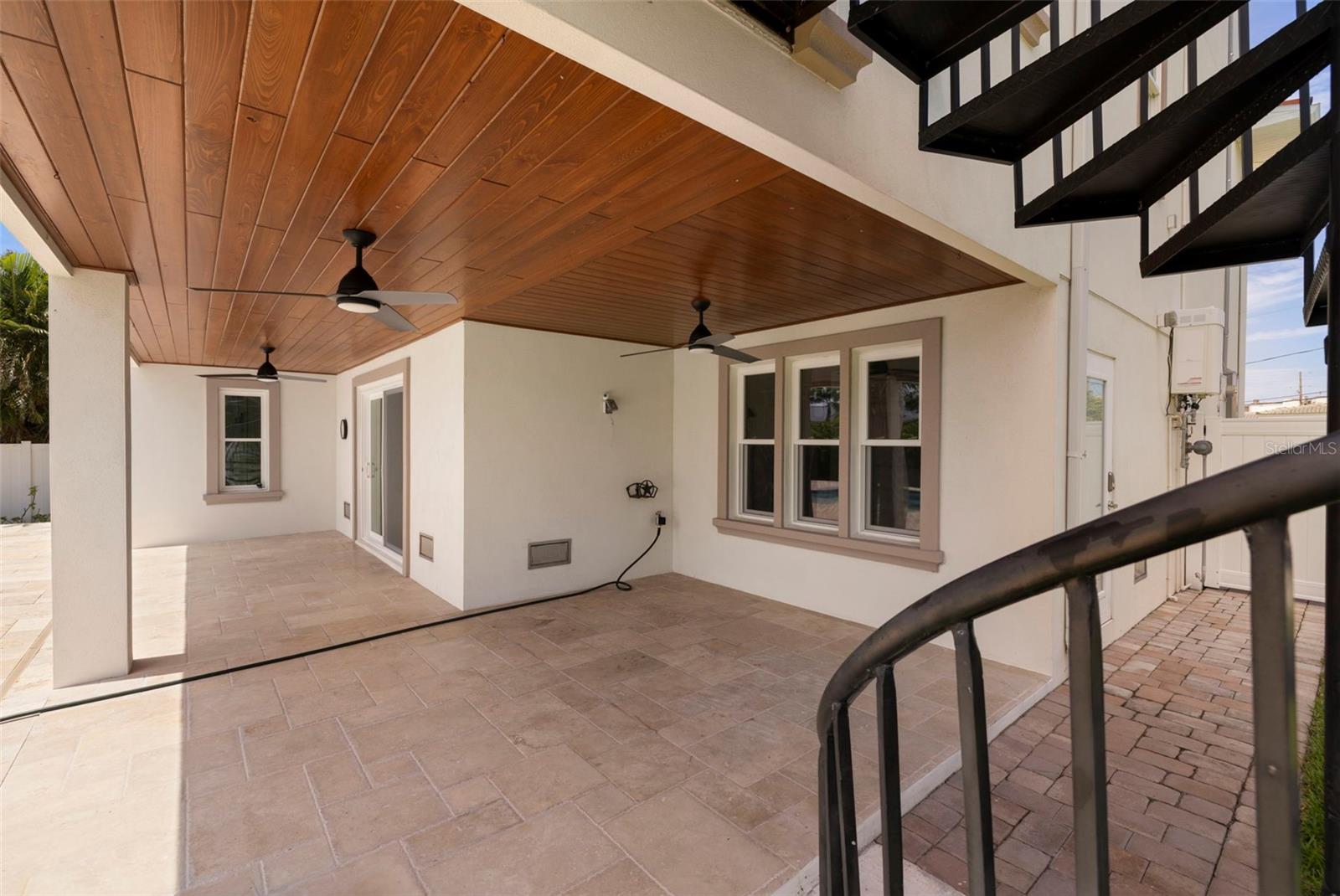 Pool sun deck and spiral staircase from the 2nd floor