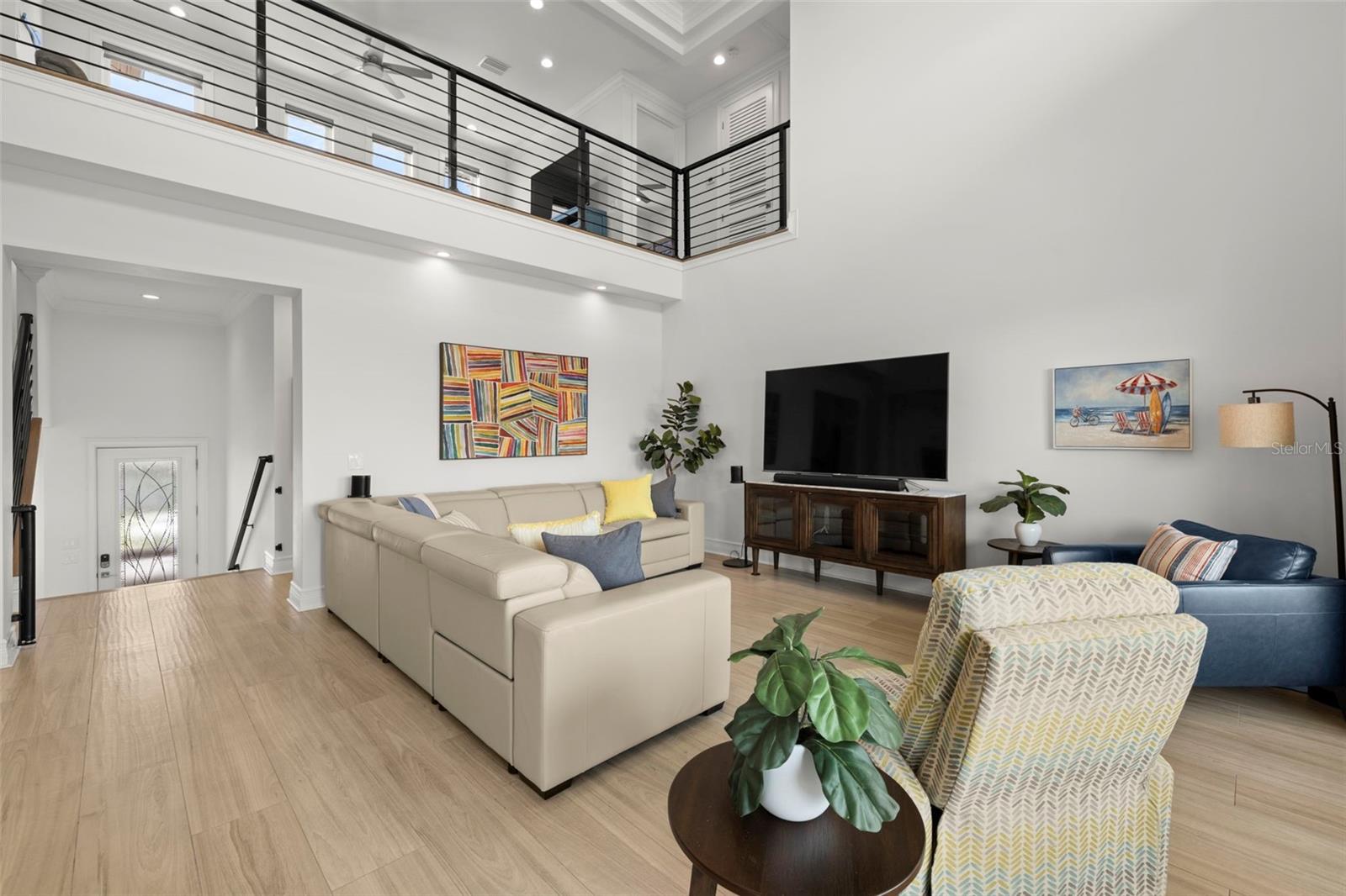 Front entrance to living room with view of loft