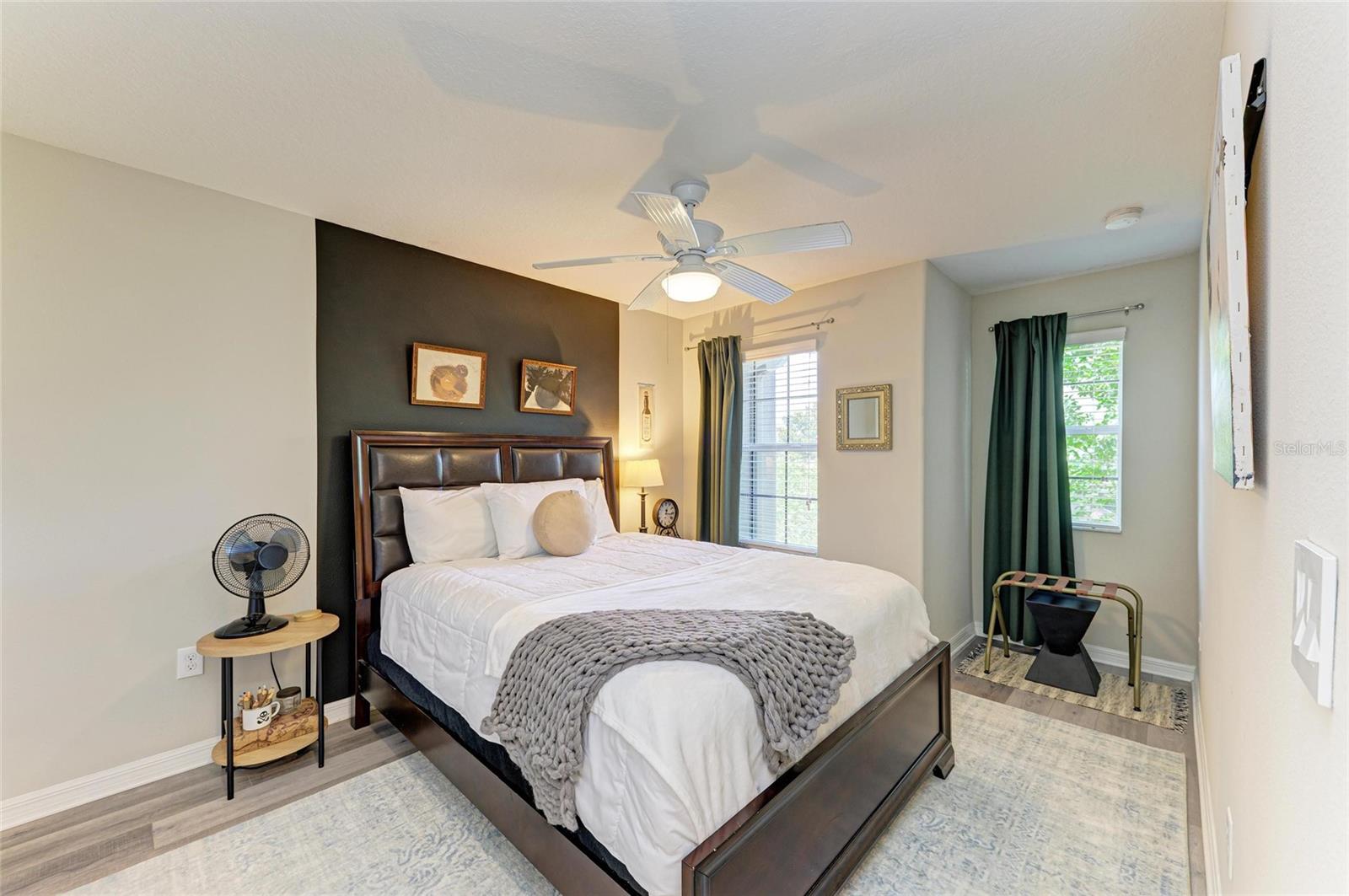 Bright, inviting second bedroom with ample space and a roomy closet