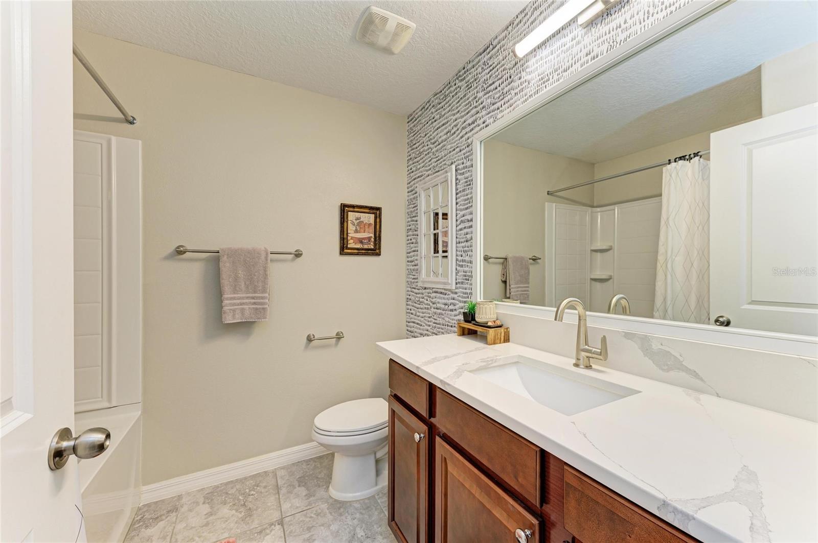 Well-appointed full guest bath