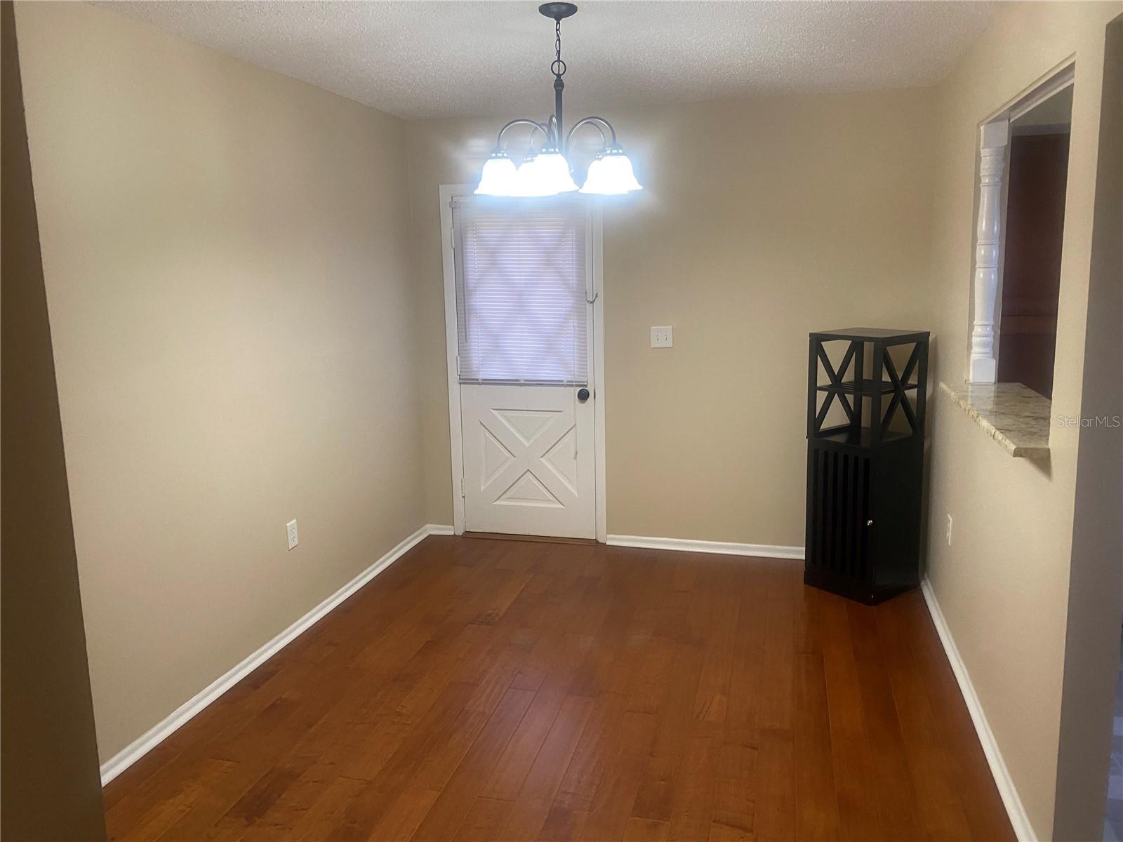 Dining room with rear exit door
