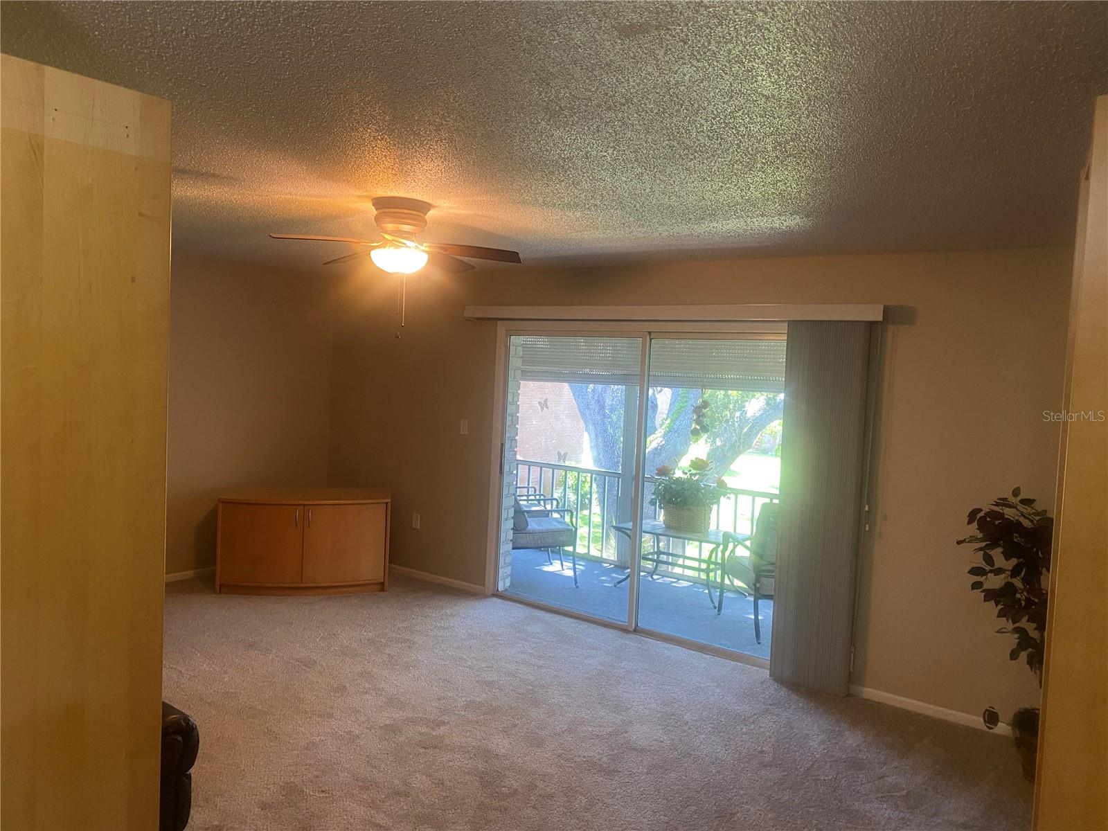 Living room opens to screen lanai