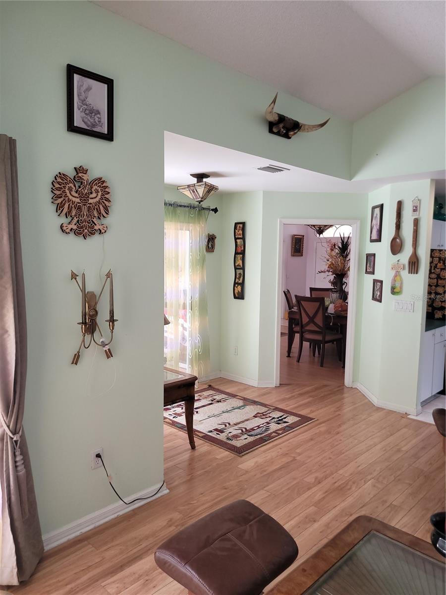 Open kitchen and media room with access to pool