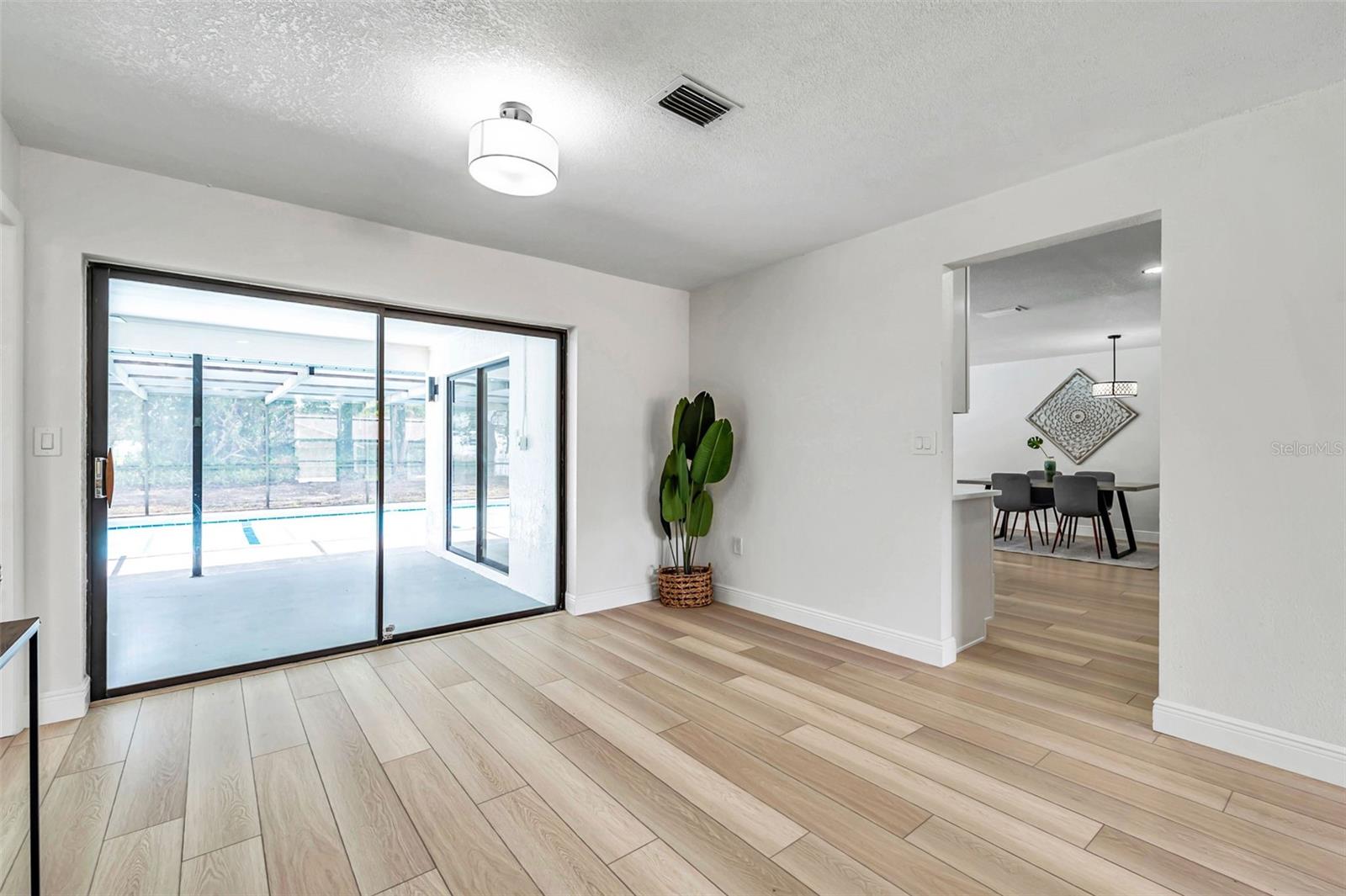 dining room and entrance to pool and kitchen