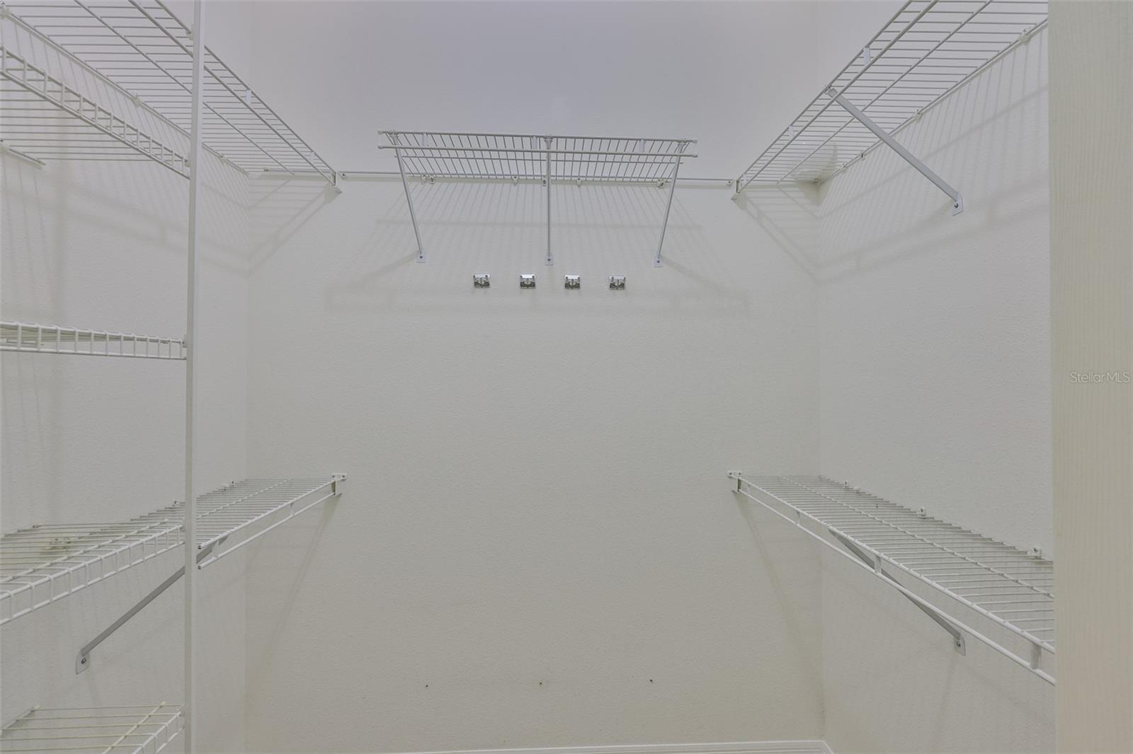 Primary walk-in closet.