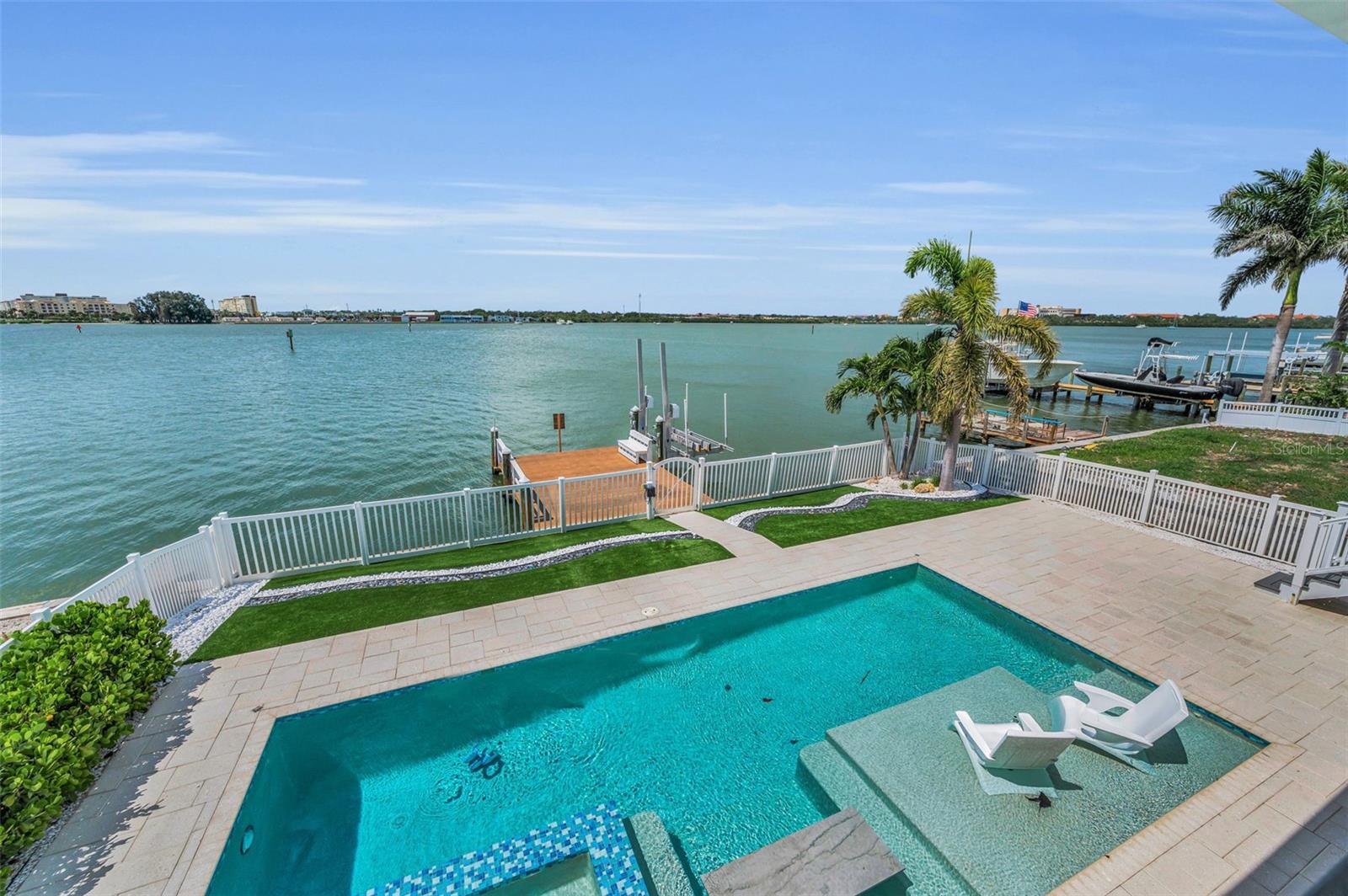 Back porch overlooking your heated & cooled inground pool!