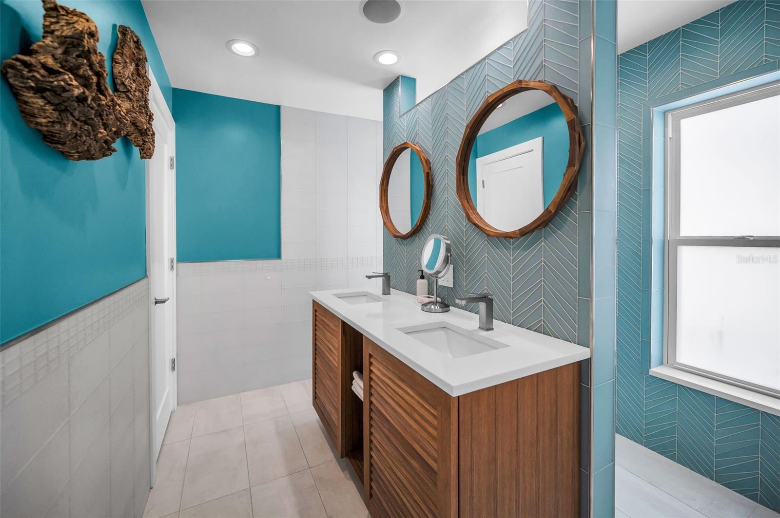 Spa Inspired Primary Bathroom with Dual Vanities.