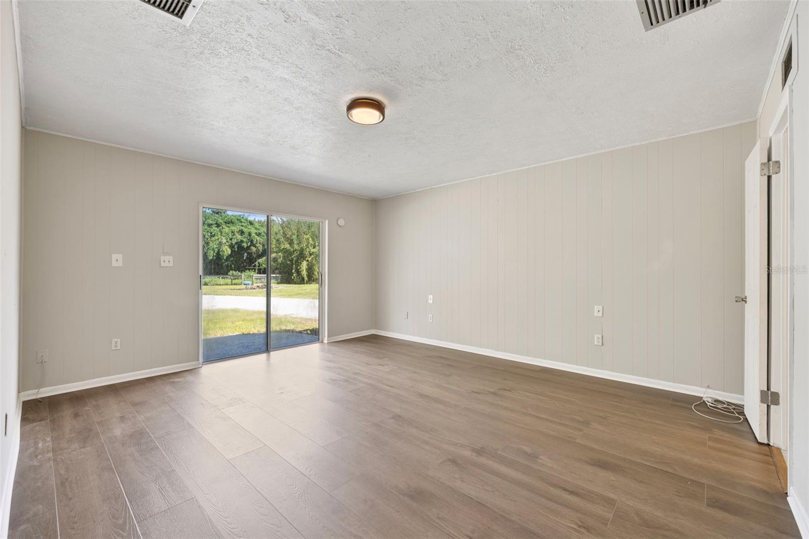 Primary Bedroom with sliding glass door