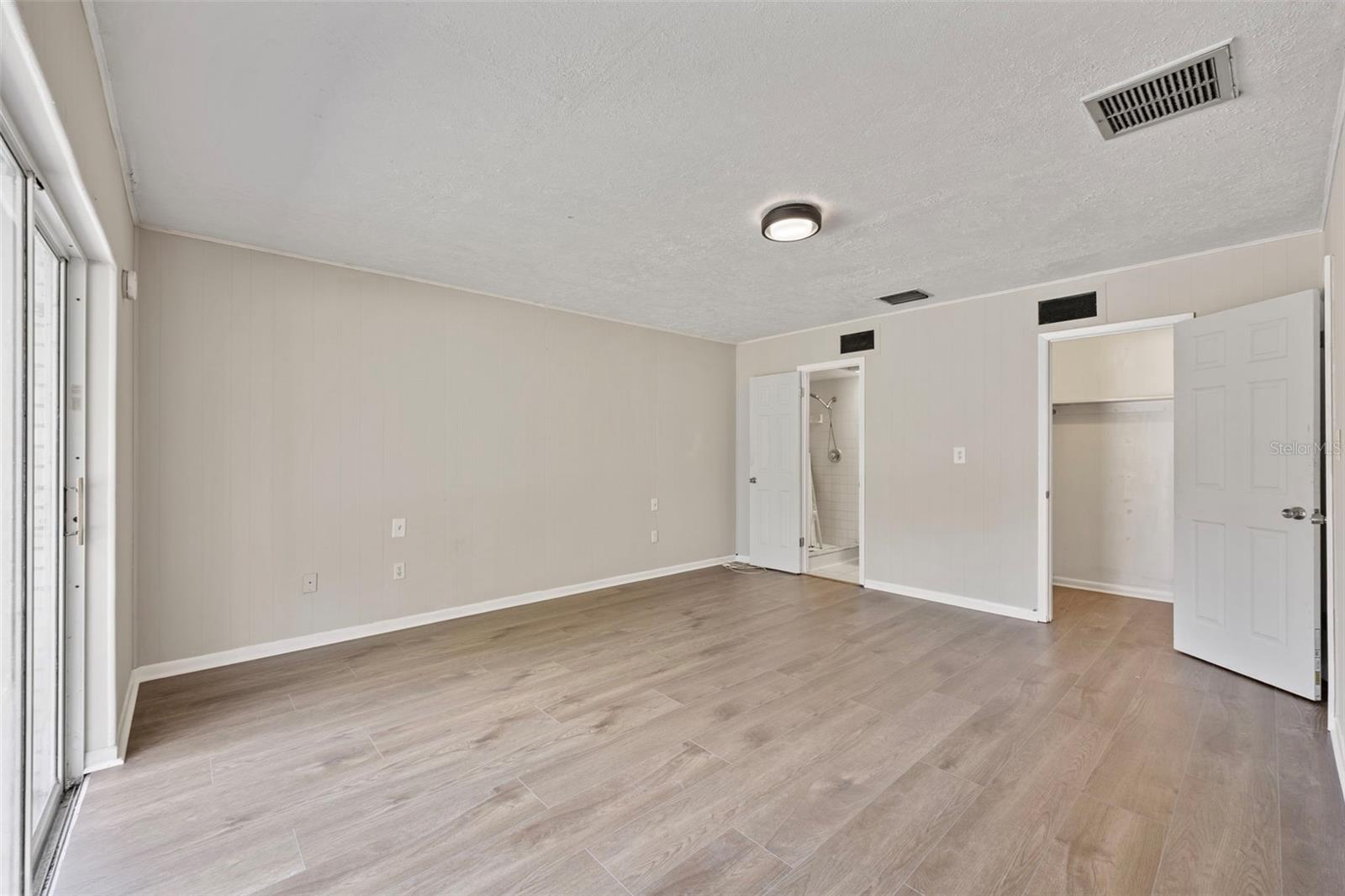 Primary Bedroom with sliding glass door