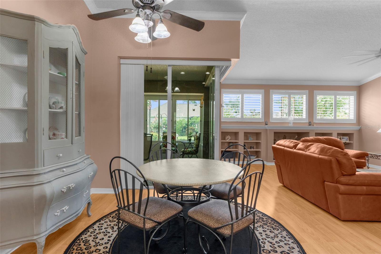 breakfast nook looking out the sliders that open up to the enclosed Florida room/ patio