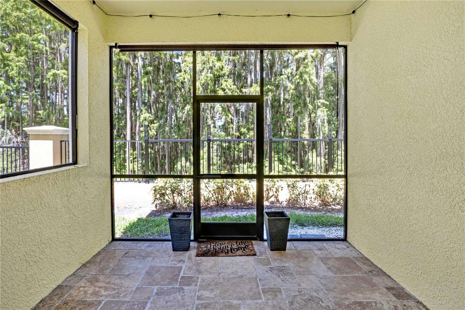 Screened-in porch overlooking the nature preserve.