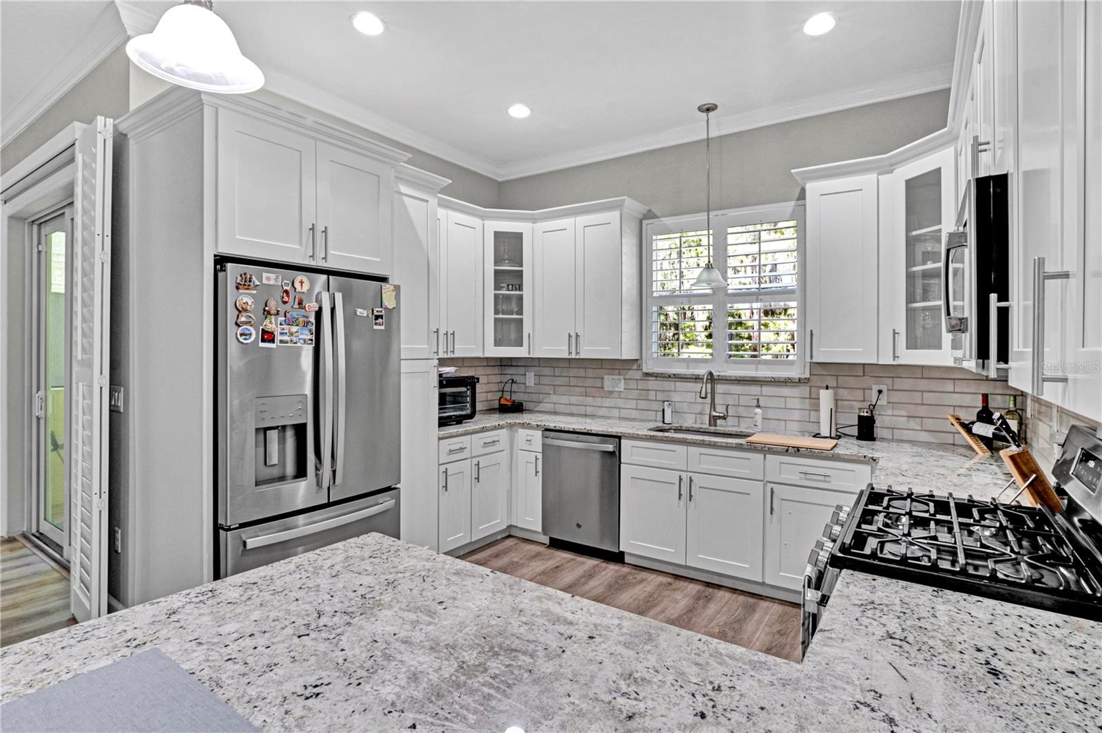 Stainless steel appliances with granite countertops.