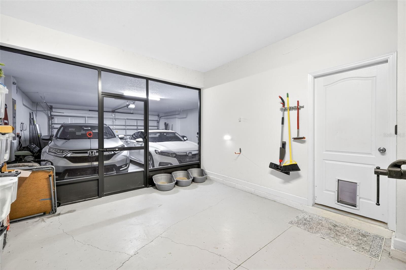 3- car tandem garage with convertible screened space