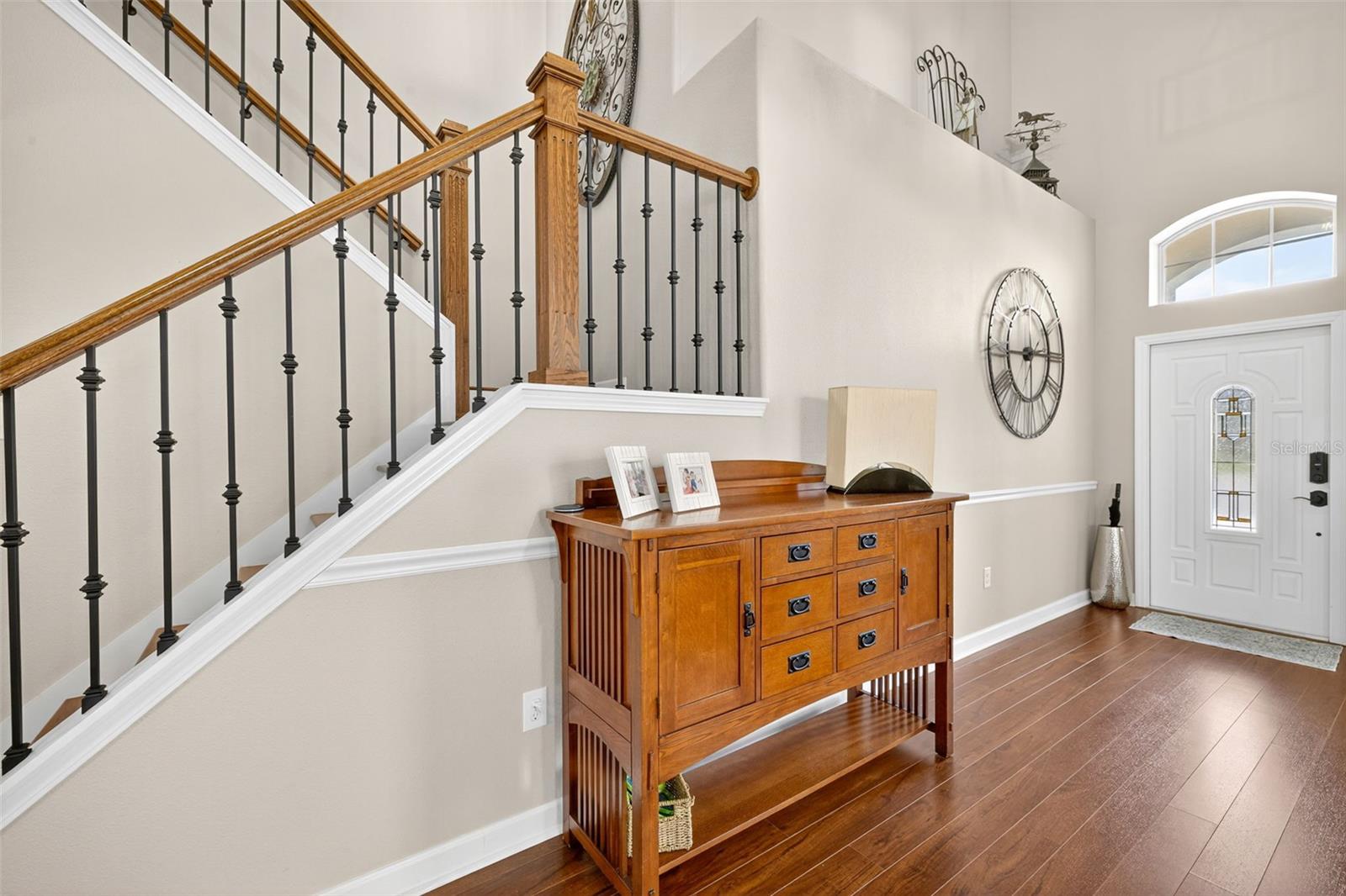 front hall with dramatic staircase