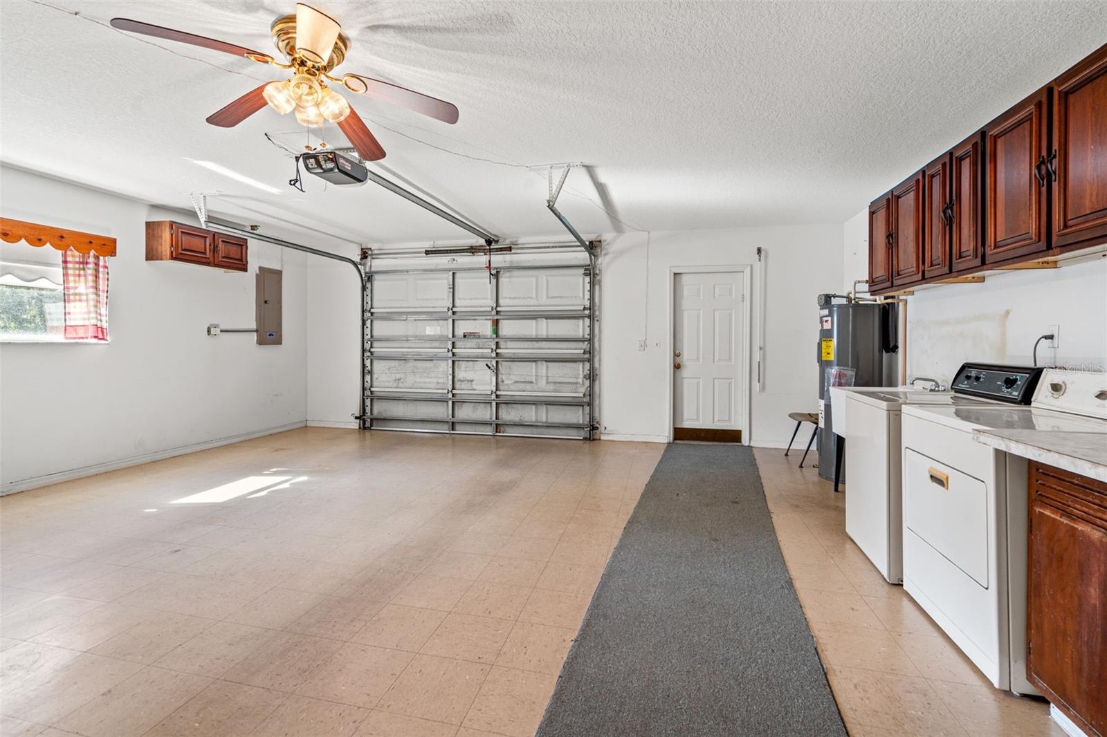 One car garage with laundry room, and utility tub