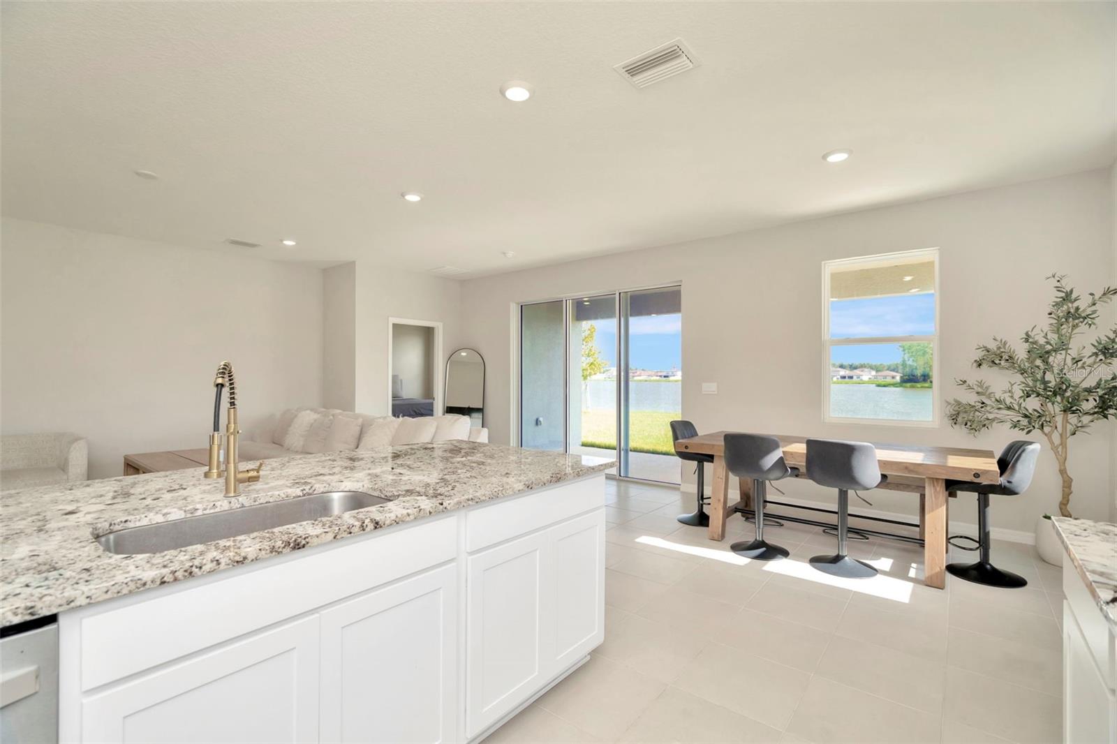Your kitchen showing the breakfast nook big enough to hold a formal dining table.