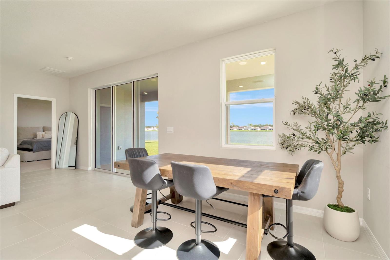The breakfast nook of your kitchen. Check out the lake views from the windows.