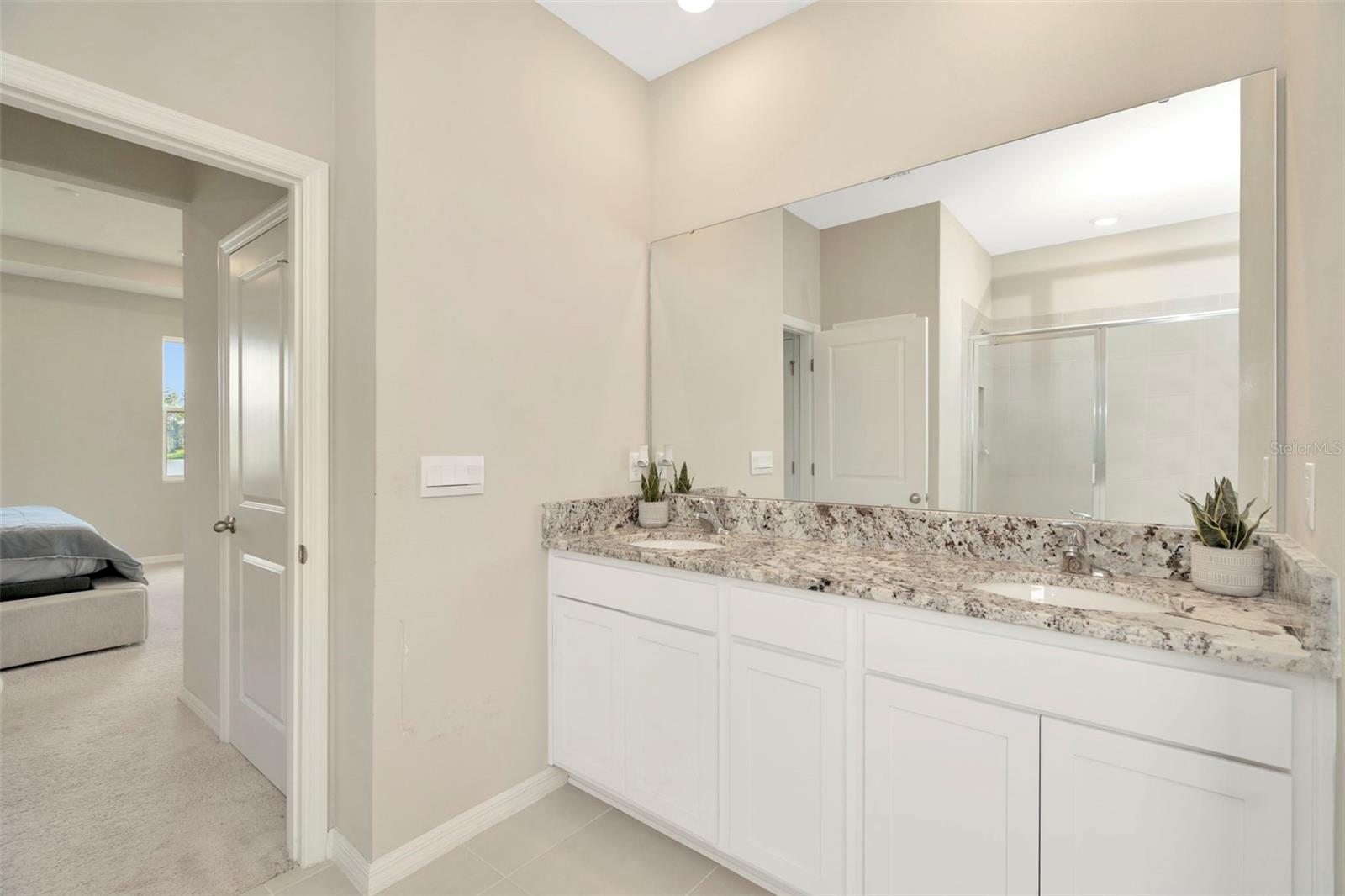 Primary bathroom with dual vanities