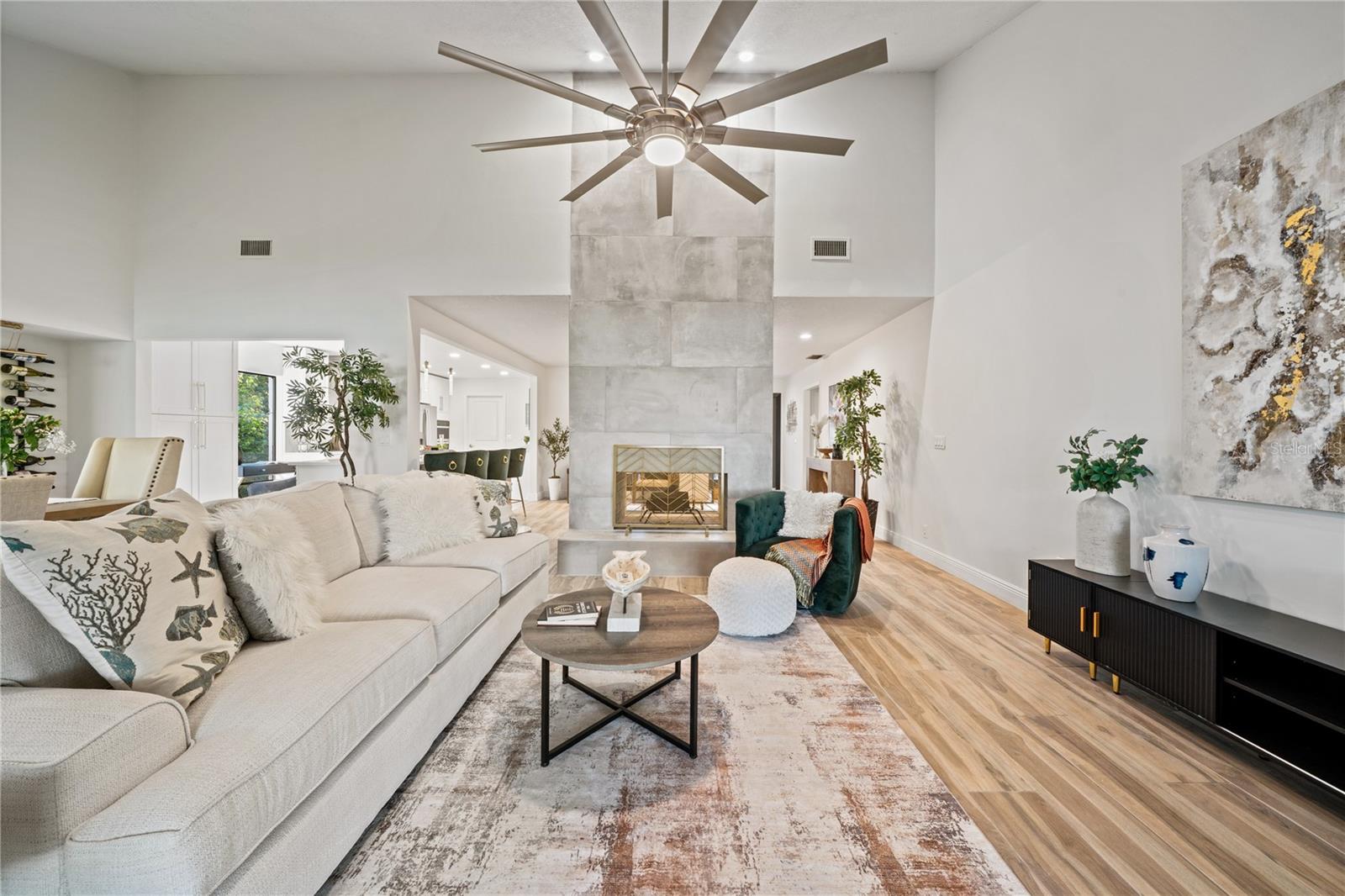 Living room with 14 feet tall double sided fireplace