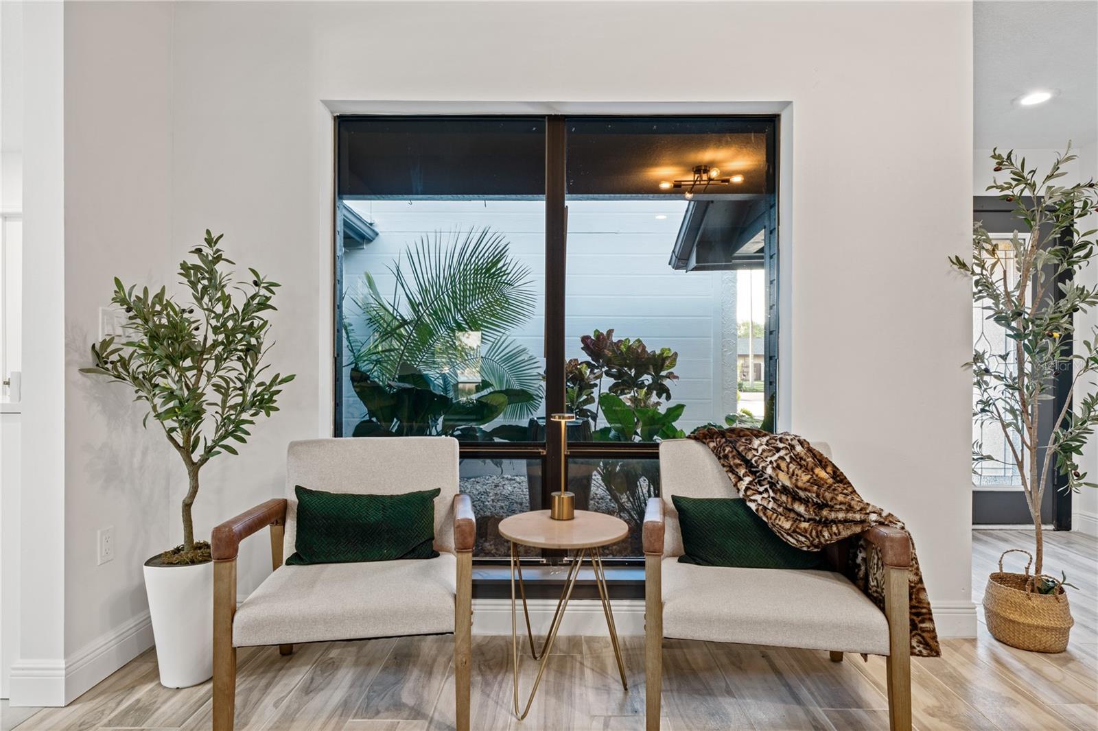 entrance seating area with large window over looking courtyard