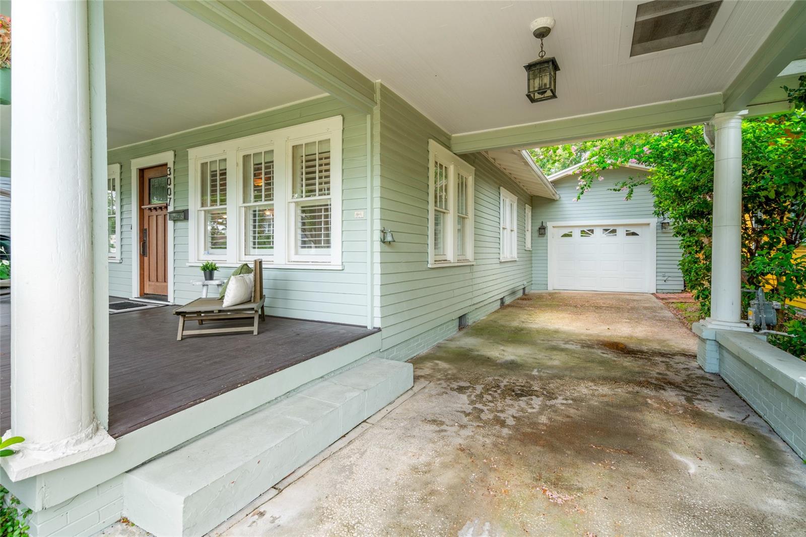 Driveway to garage with covered parking