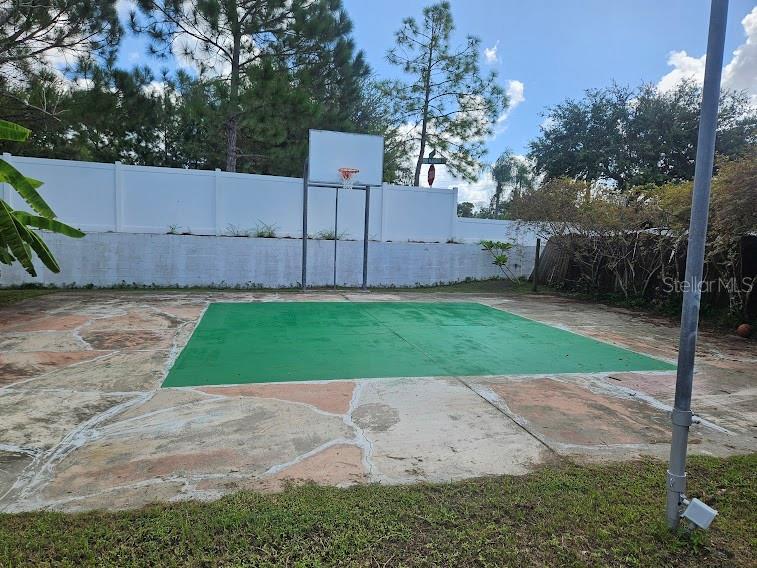 Lights on Basketball Court in Back Yard.