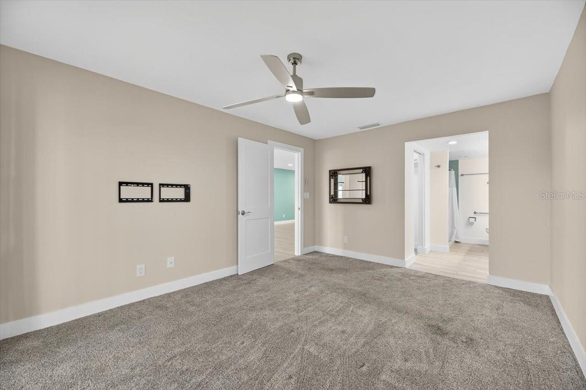 Master bedroom view of entry door and bath entry.