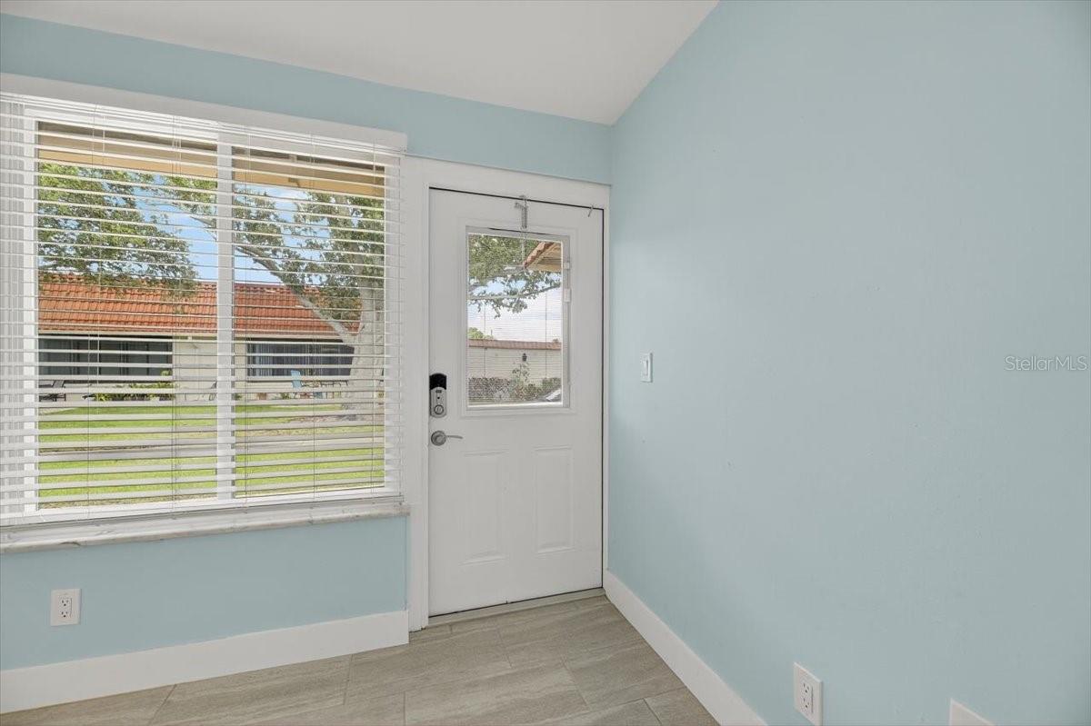 Entry from rear patio and parking.