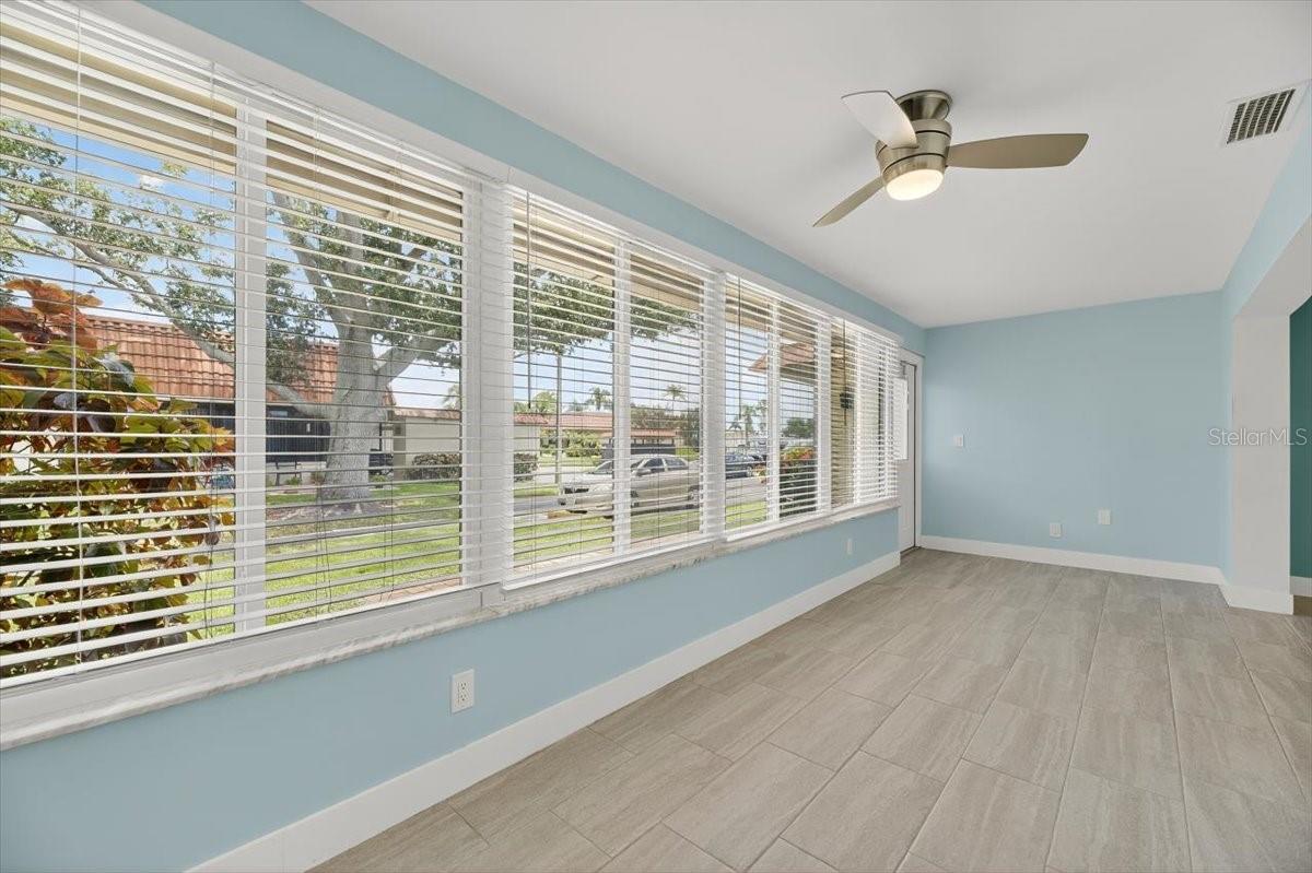 Enclosed porch looking at door.