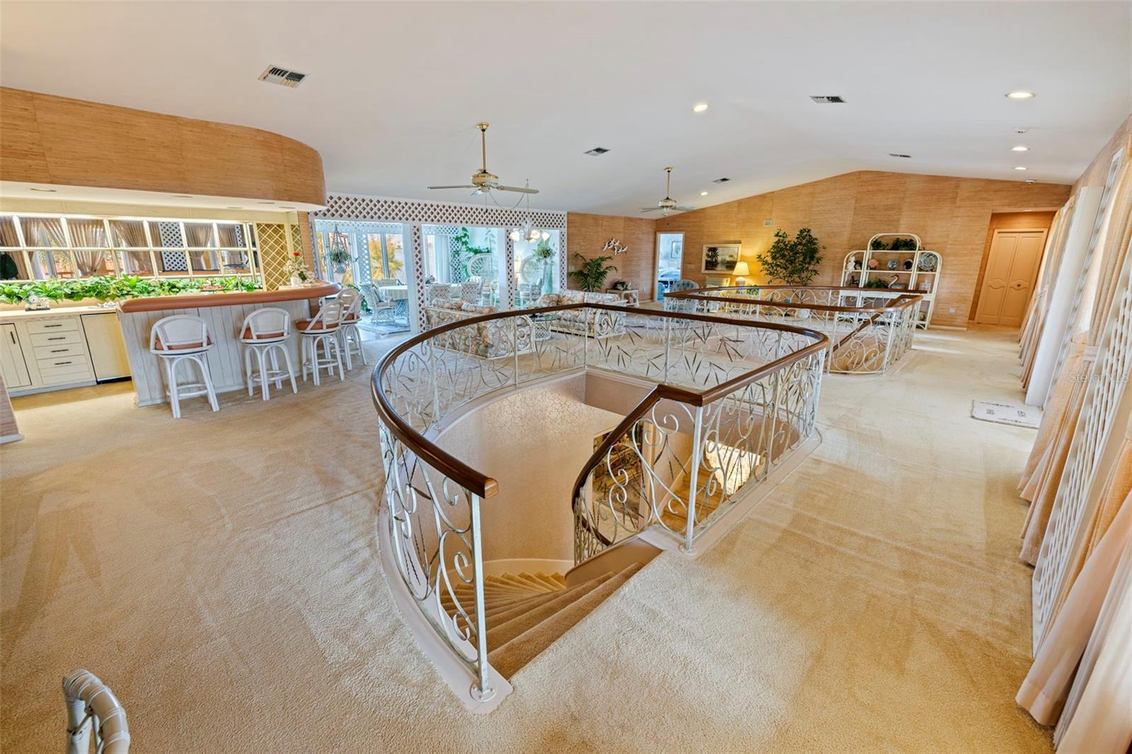 Upstairs you'll find 5 bedrooms with a Great Room in the center which includes a sitting area, a complete wet bar, a dining area/garden room/tea room, and a sauna with it's sitting room.