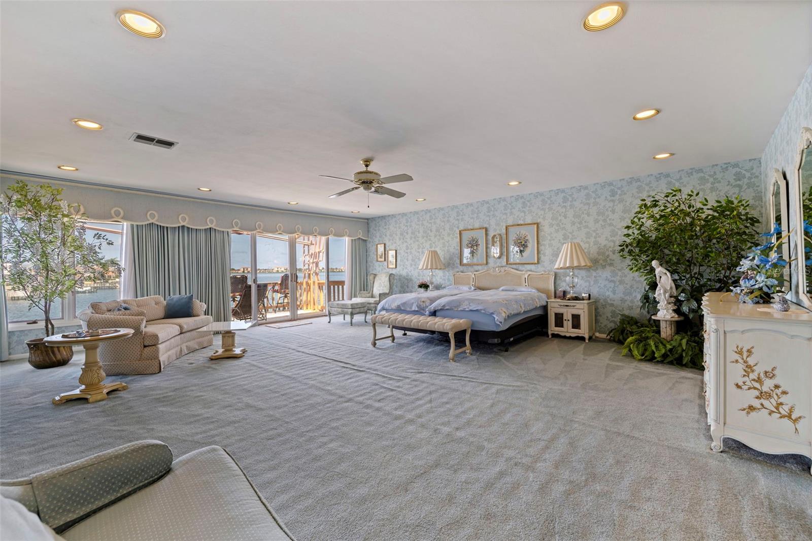 Primary suite bedroom with it's own private balcony