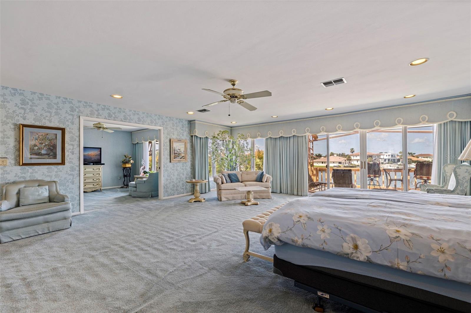 Primary suite with a sitting room and private balcony