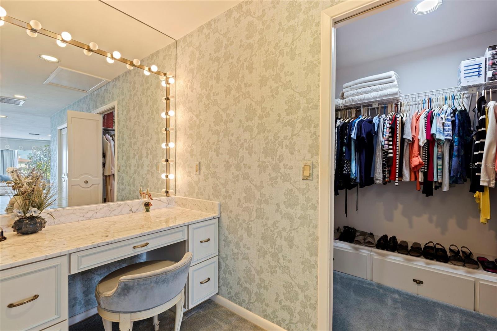 Vanity station and one of the closets in the Primary Suite