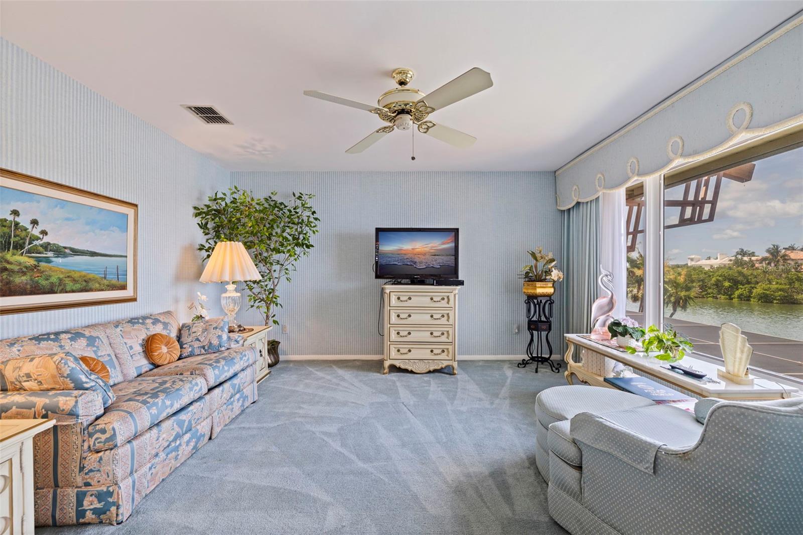 Sitting/TV room in the Primary Suite with pocket doors for privacy