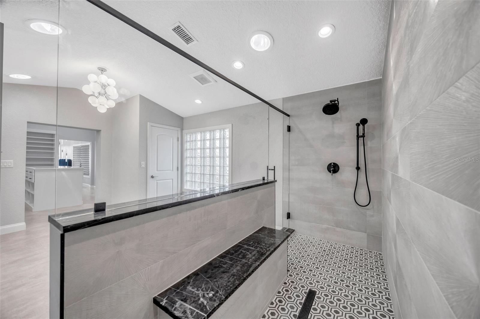Primary Shower with Marble Flooring
