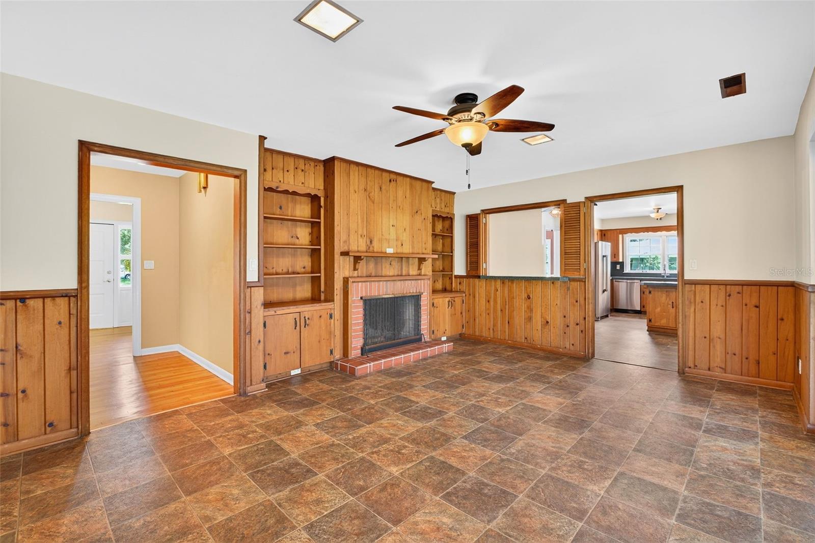 Family room with built-ins and a fireplace