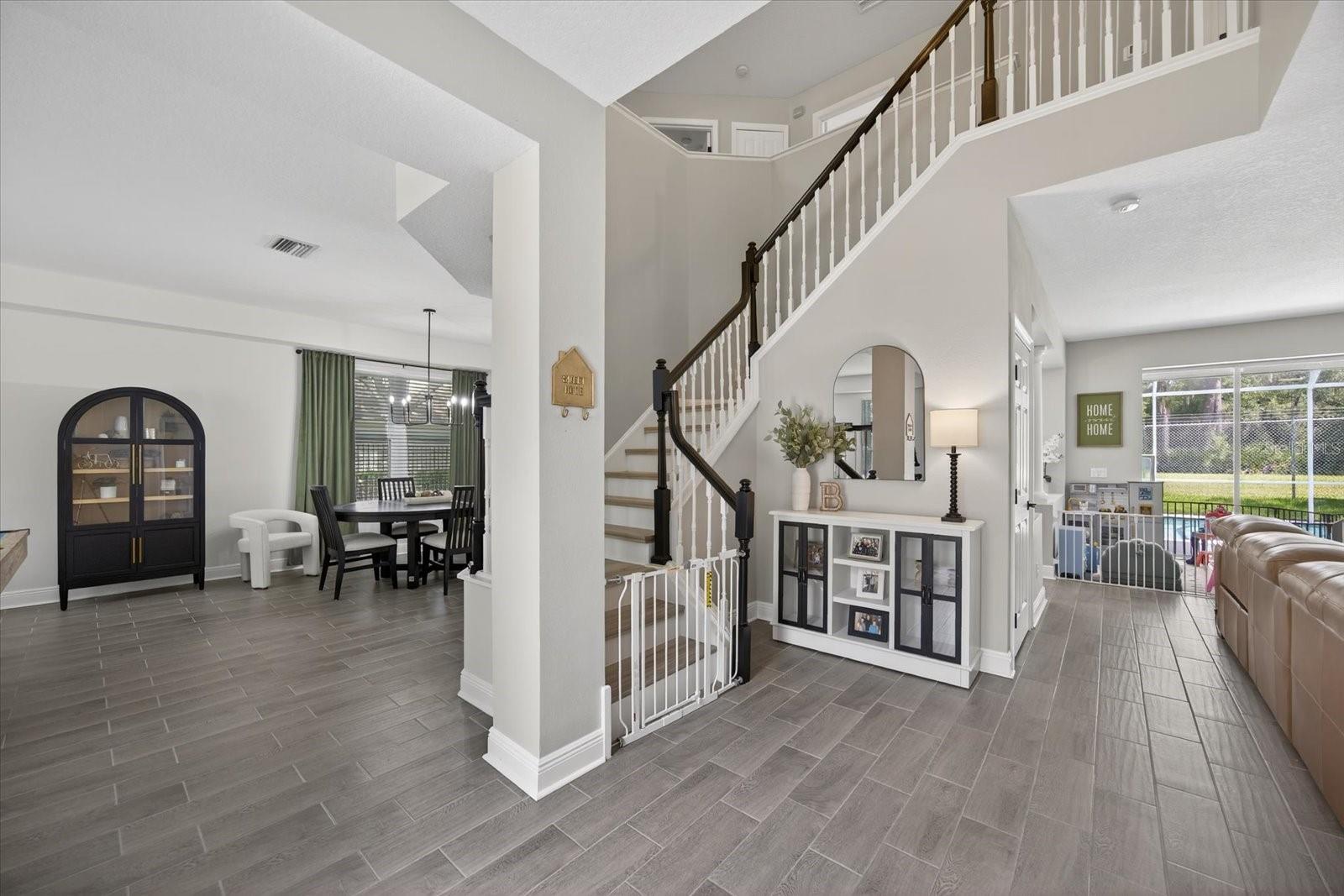 Entryway view with open staircase and ceiling. Gorgeous natural light.