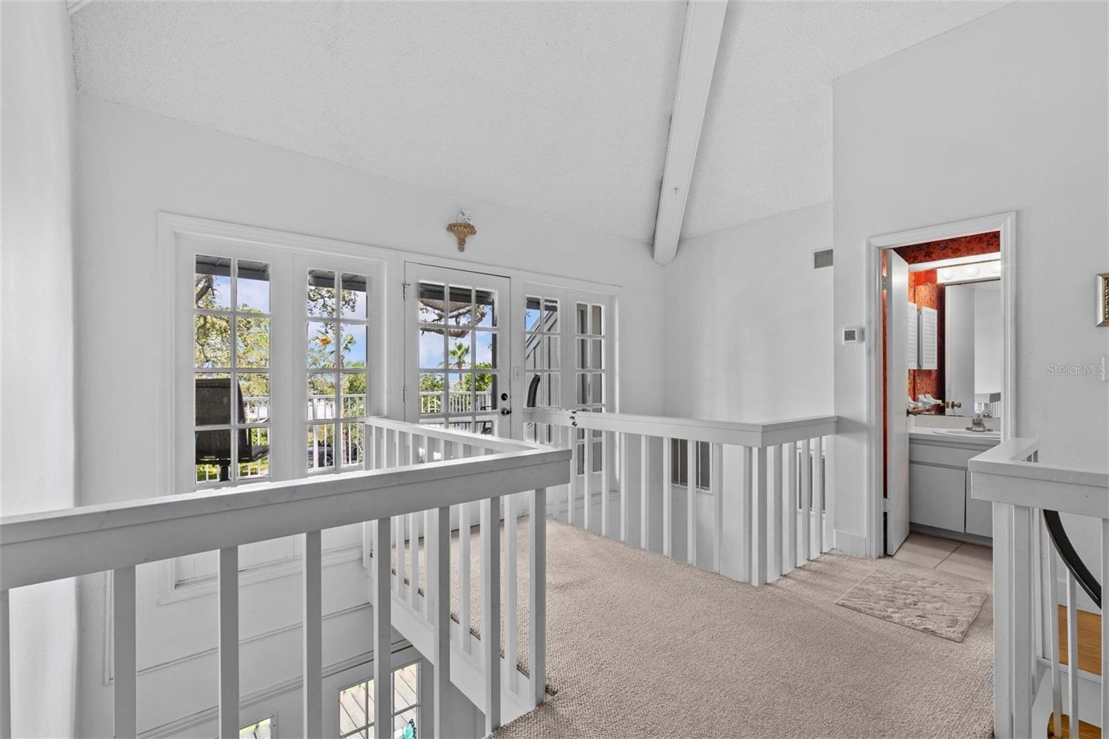 Primary BR, sitting area and private porch