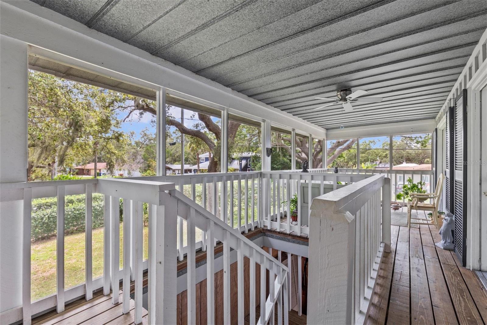 back porch with staircase to the garage