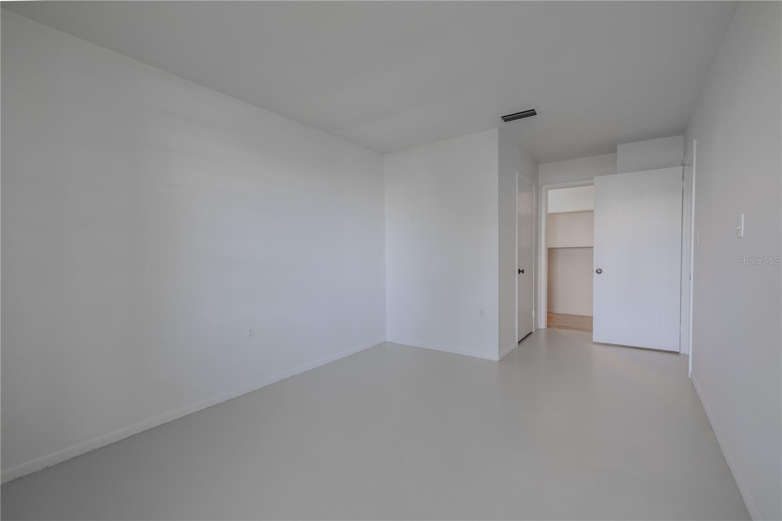 Primary bedroom has dual closets.